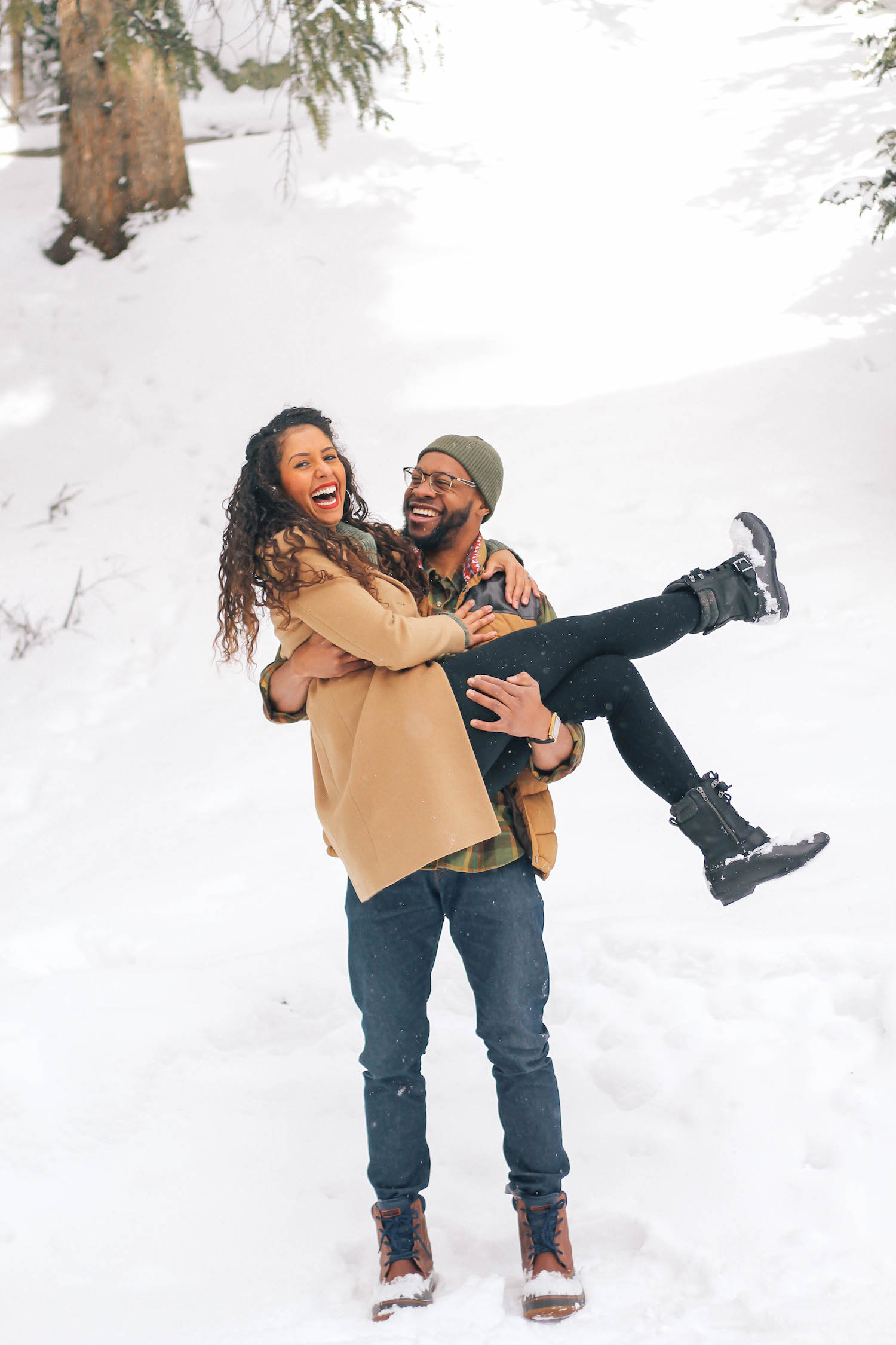 Young couple hugging and kissing on a snowy winter park near of a many big  trees full of snow. Concept of joint rest. Winter Photography 2021 Stock  Photo - Alamy